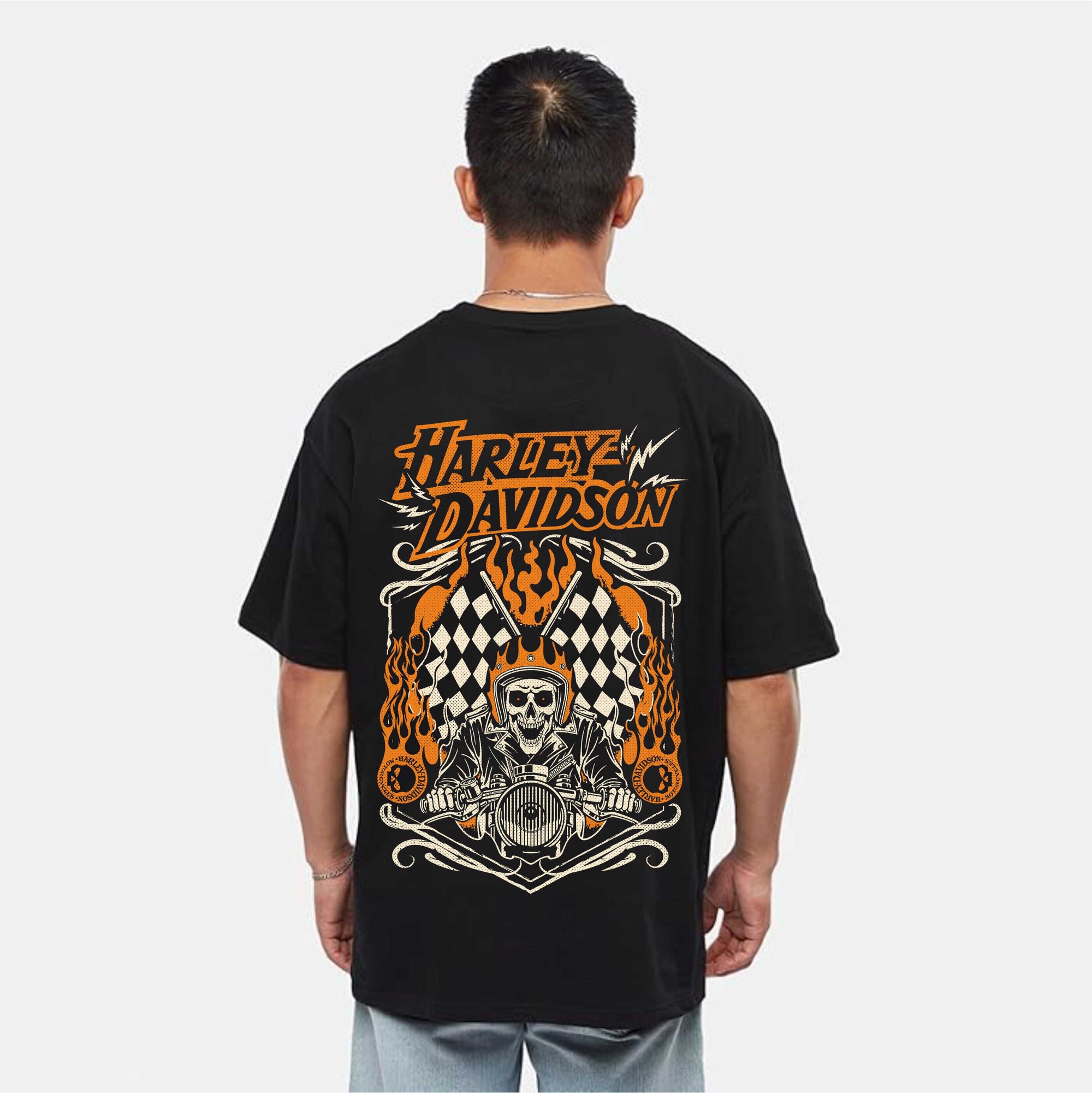 Person wearing a black Harley Davidson t-shirt with a graphic design on the back.