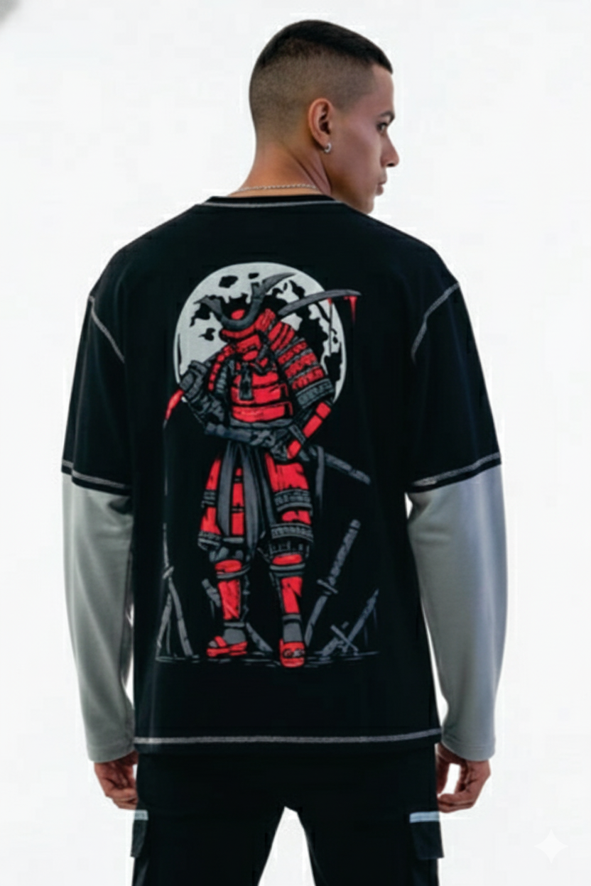 Person wearing a black and gray long-sleeve shirt with a graphic design on the back.