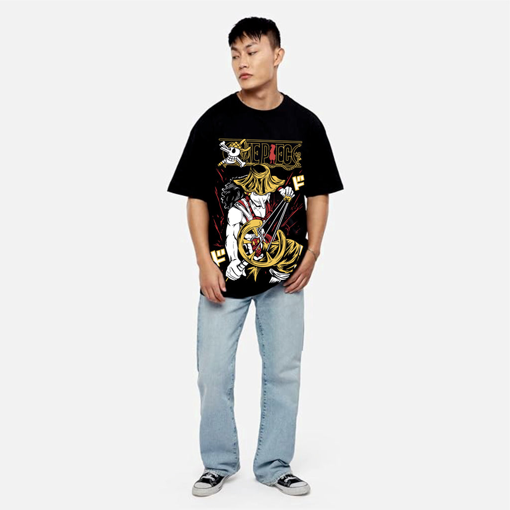 Person wearing a black graphic t-shirt and light blue jean.