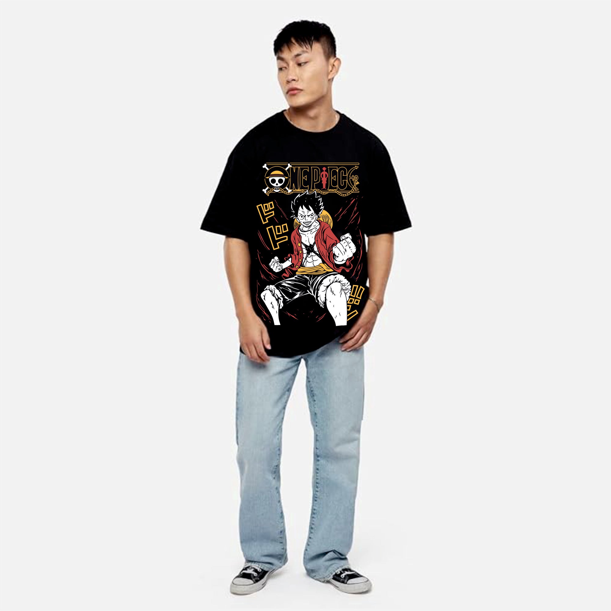 Person wearing a black t-shirt with a graphic desig.