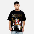 Person wearing a black t-shirt with a Onepiece graphic design.
