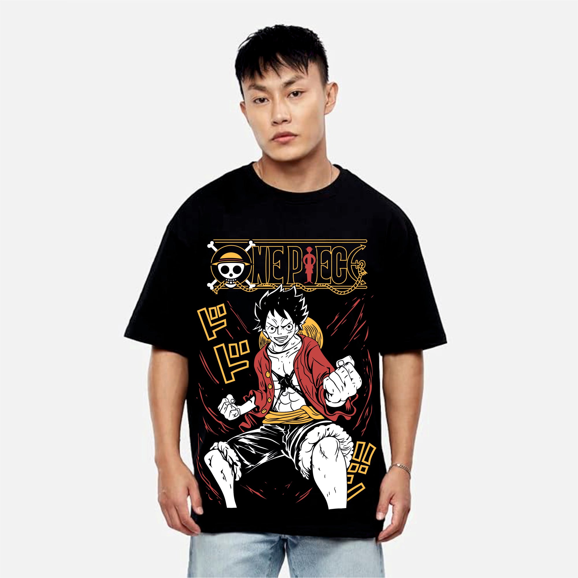 Person wearing a black t-shirt with a Onepiece graphic design.