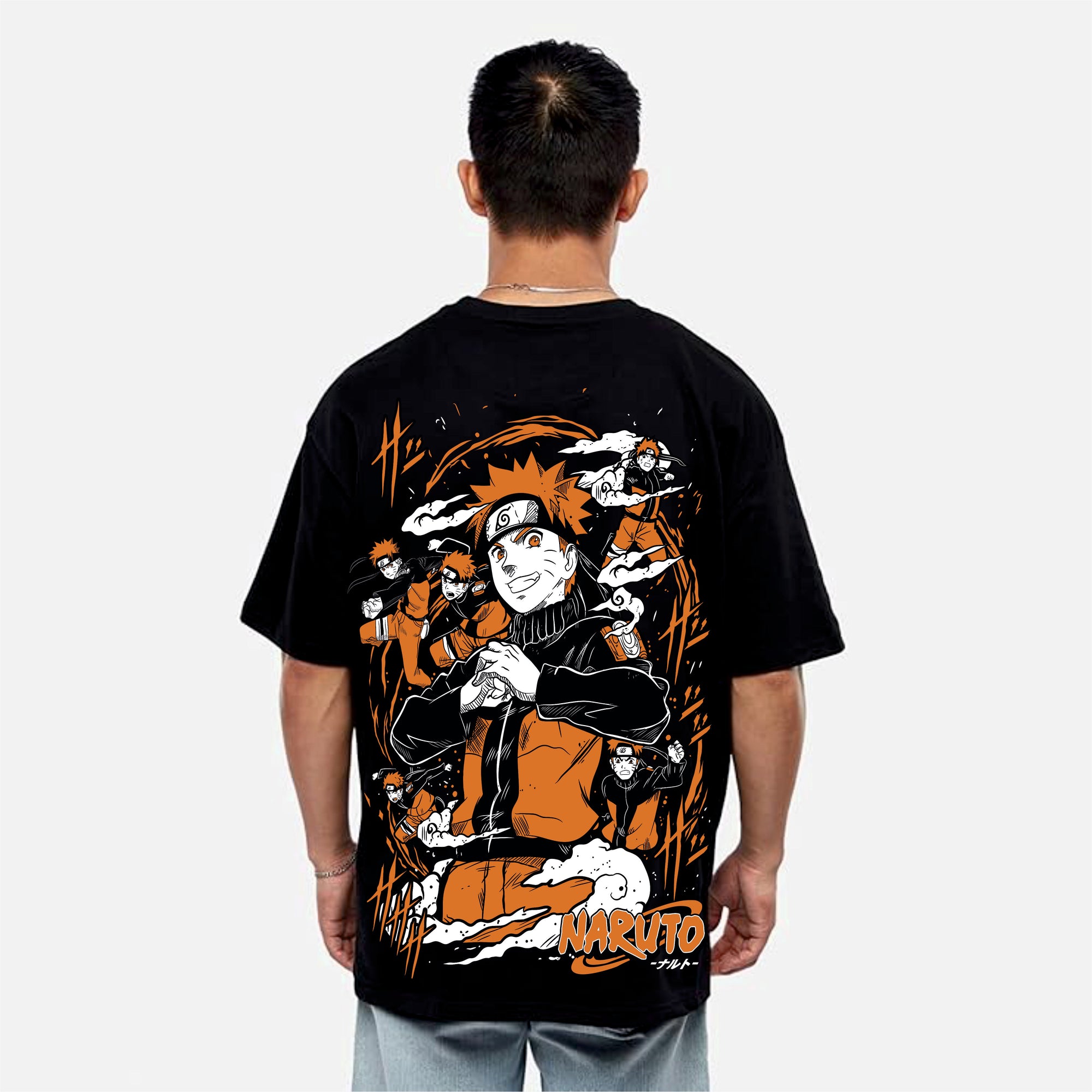 Person wearing a black t-shirt with a graphic design on the back, featuring characters and the word 'Naruto'.