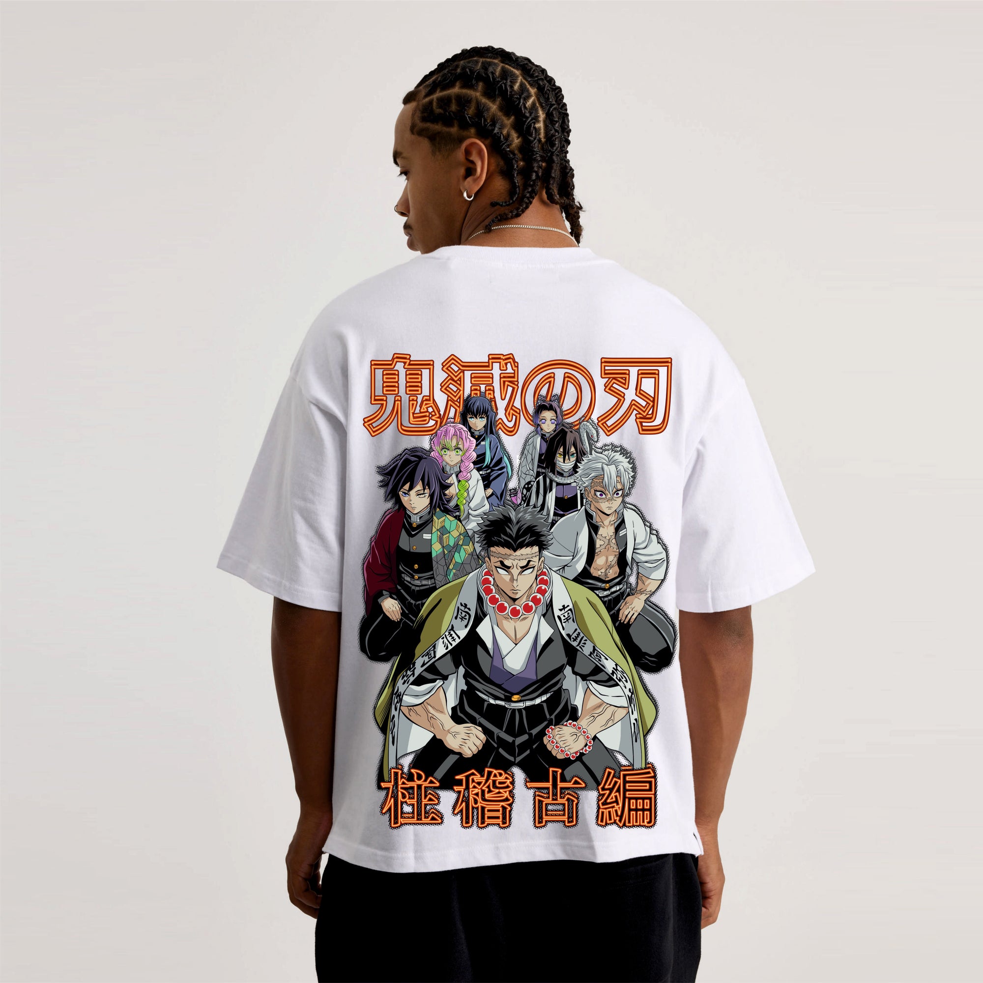 Person wearing a white t-shirt with anime character design on the back