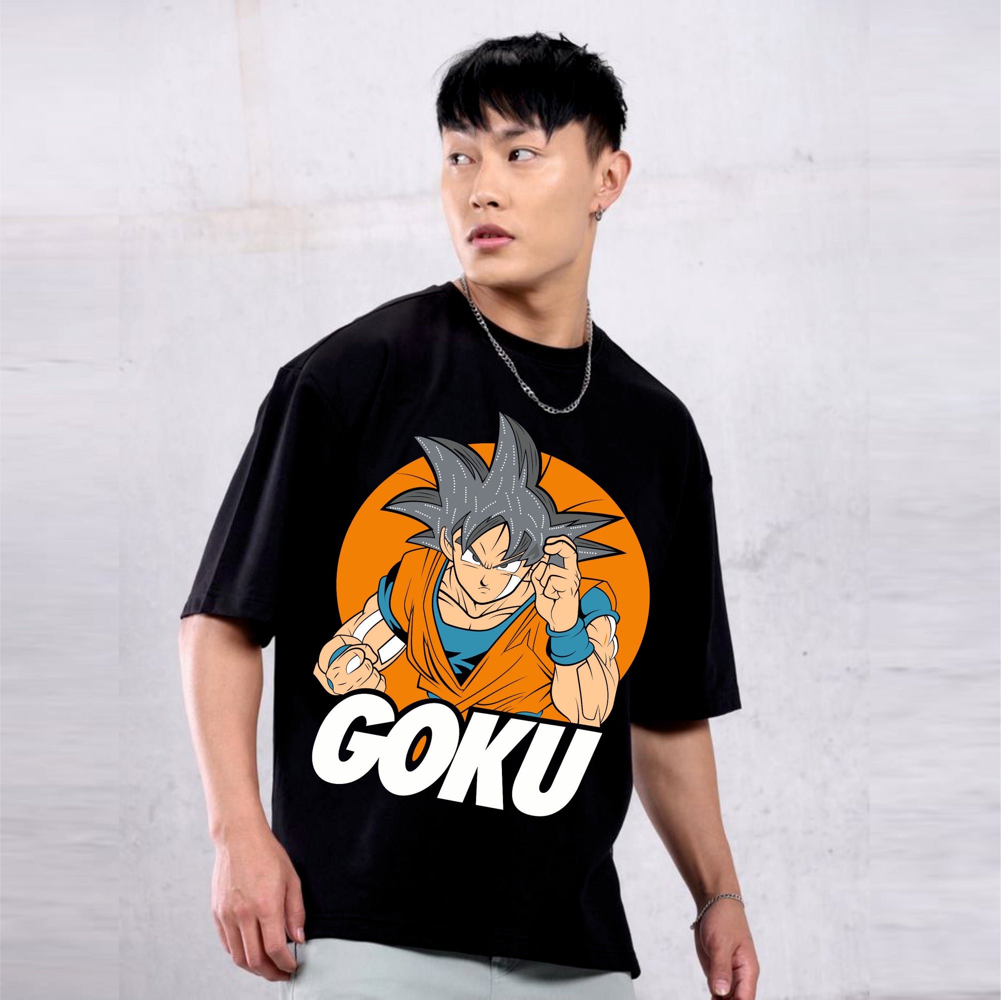 Person wearing a black t-shirt with a graphic of Goku from Dragon Ball Z