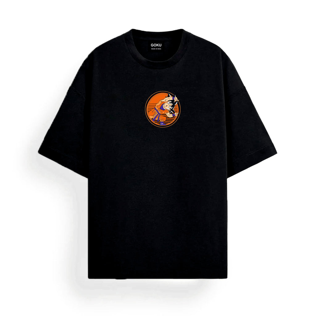 Black t-shirt with a small graphic Goku on the chest against a white background