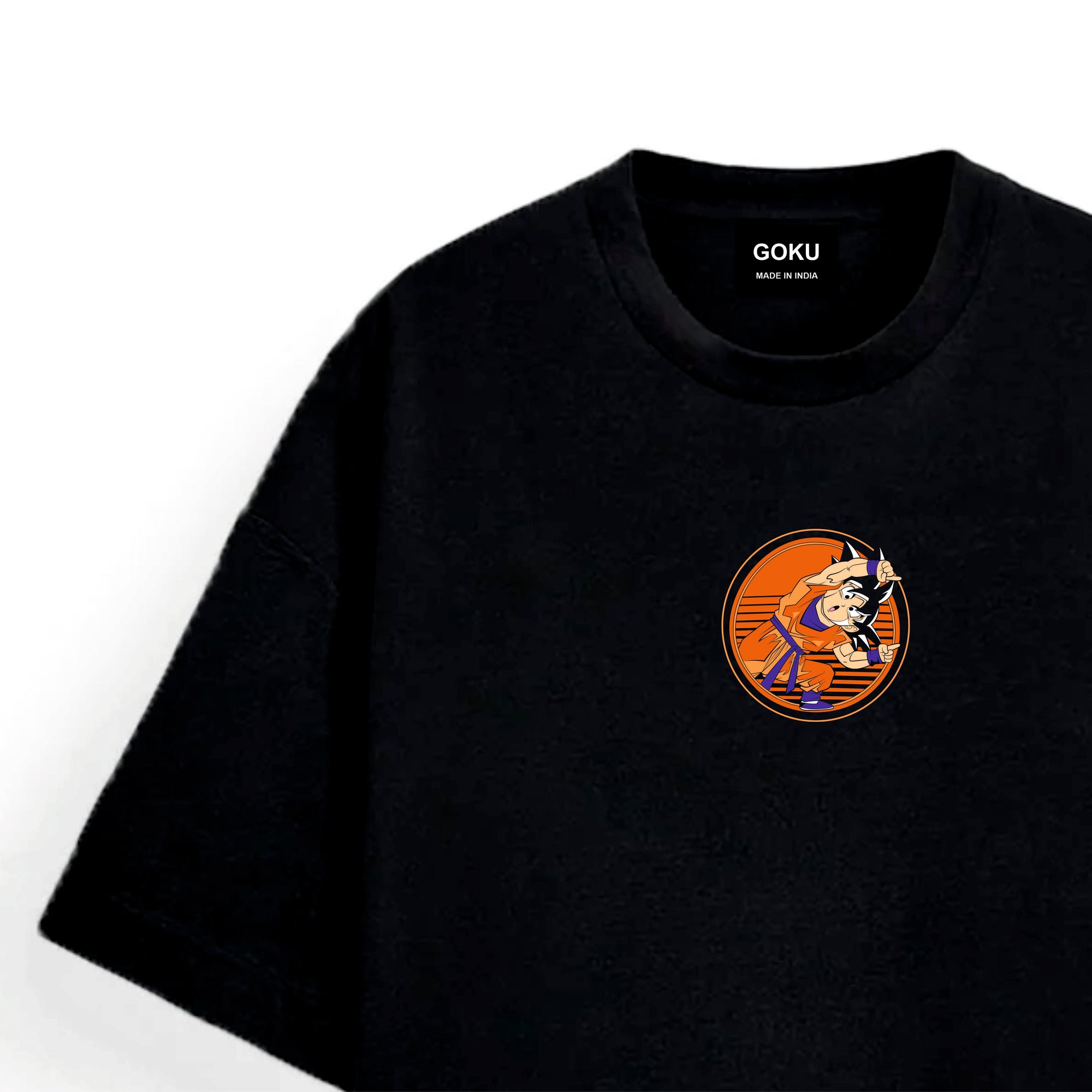 Black t-shirt with a small graphic Goku on the chest against a white background