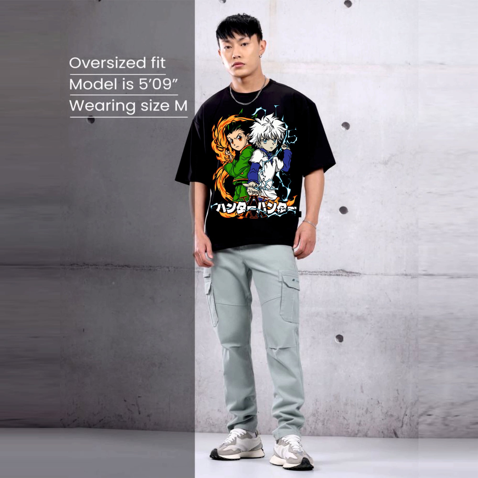 Person wearing a black t-shirt with colorful graphics hunter x