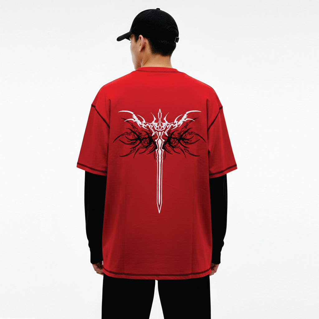 Person wearing a red t-shirt with a white dragon design on the back, standing against a white background.