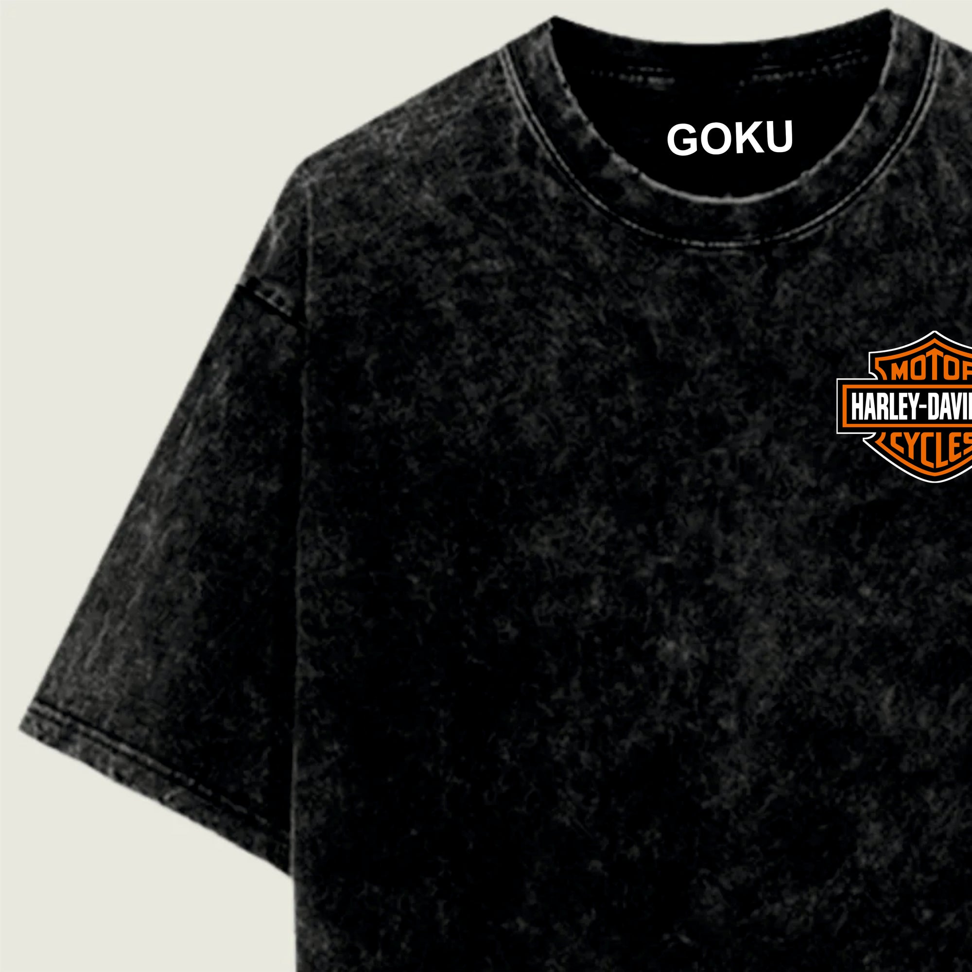 Acid washed t-shirt with 'GOKU' and Harley-Davidson logo on a beige background