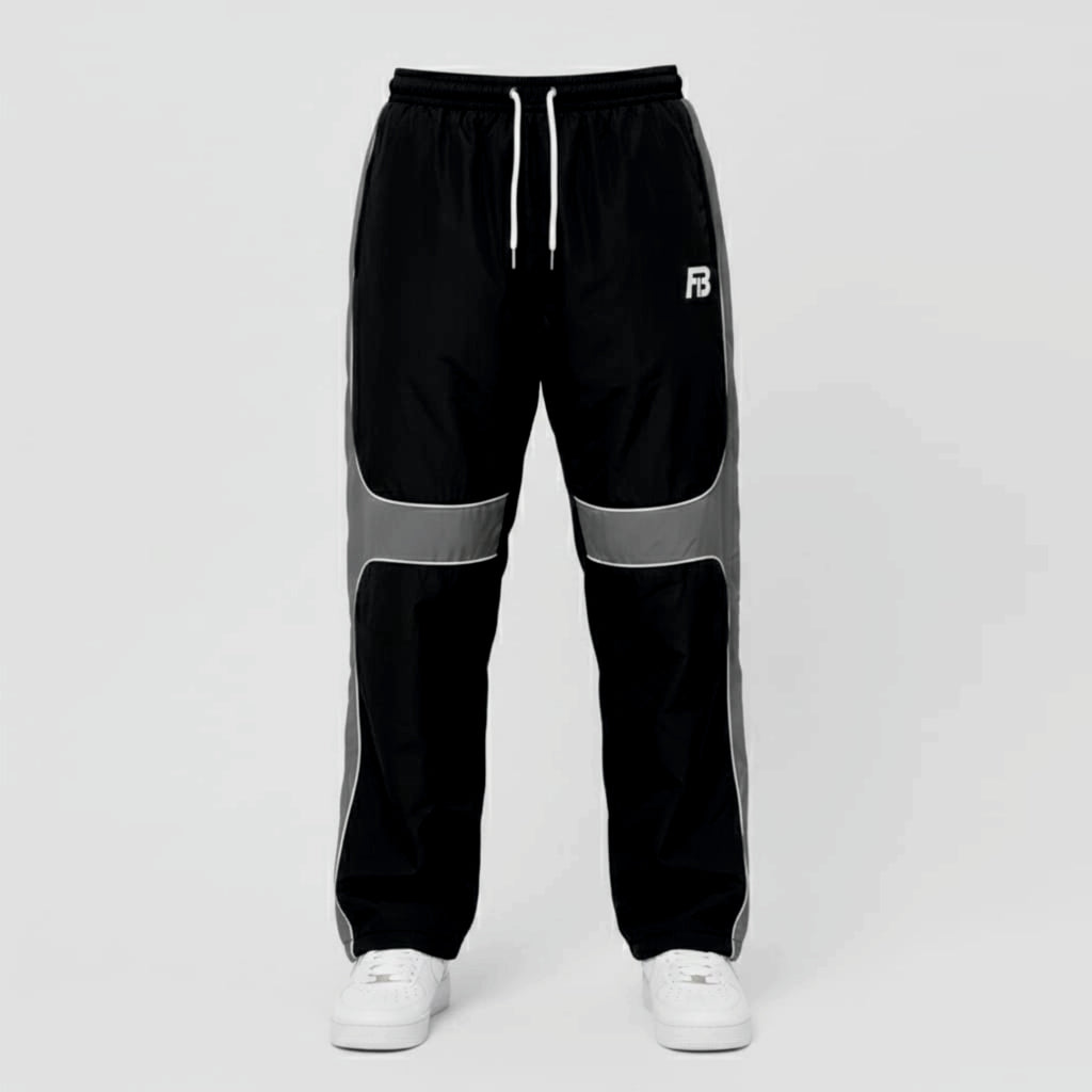Black and gray track pants with a brand logo on a light gray background
