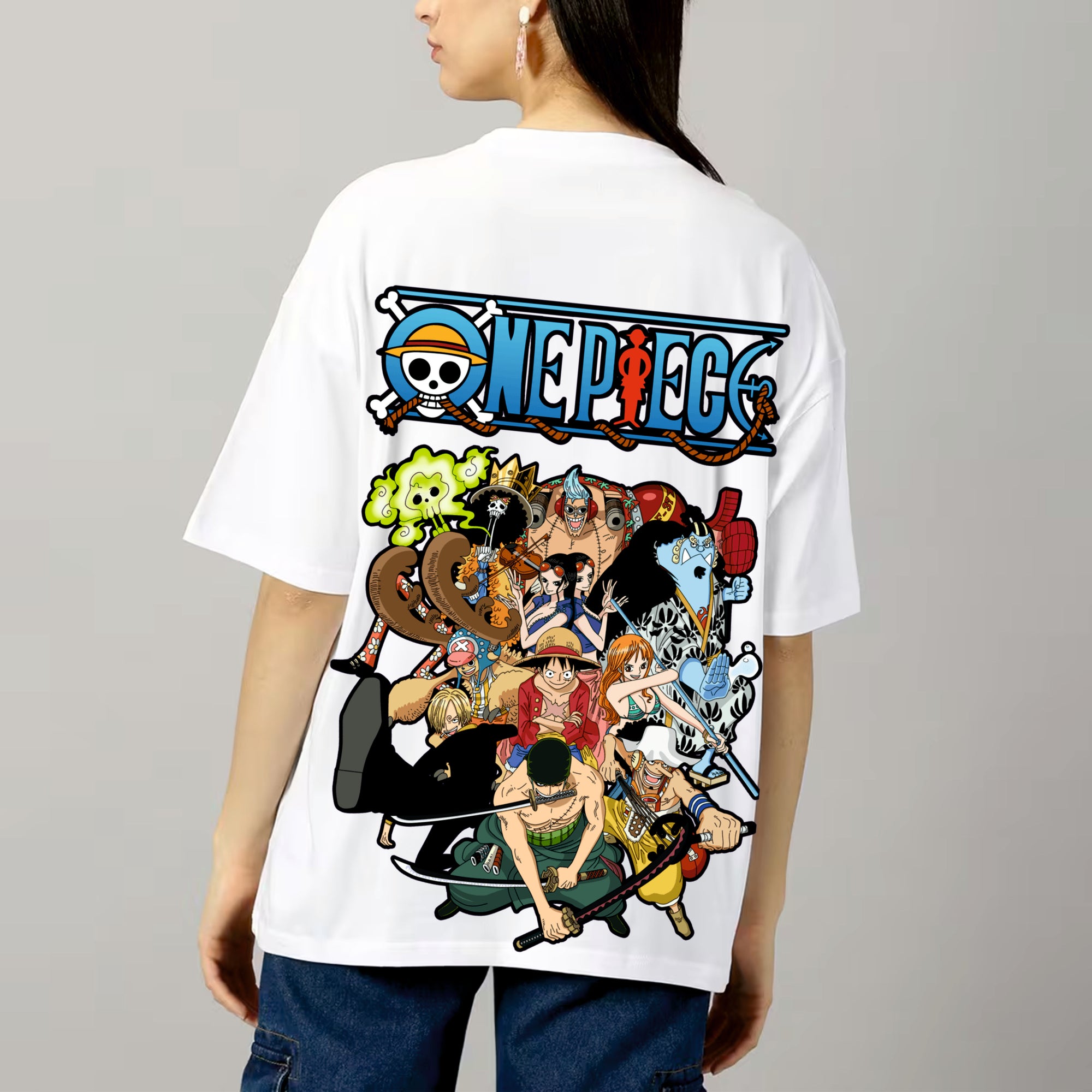 Person wearing a white 'One Piece' t-shirt with colorful character design on a gray background