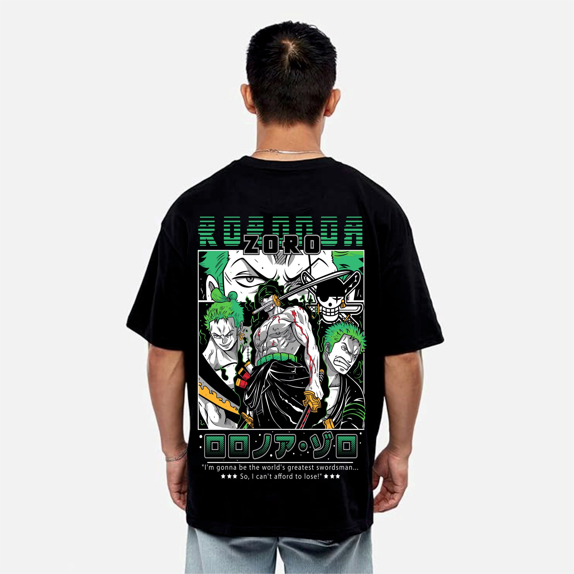 Person wearing a black t-shirt with a colorful graphic design on the back, featuring a character with green hair and text.