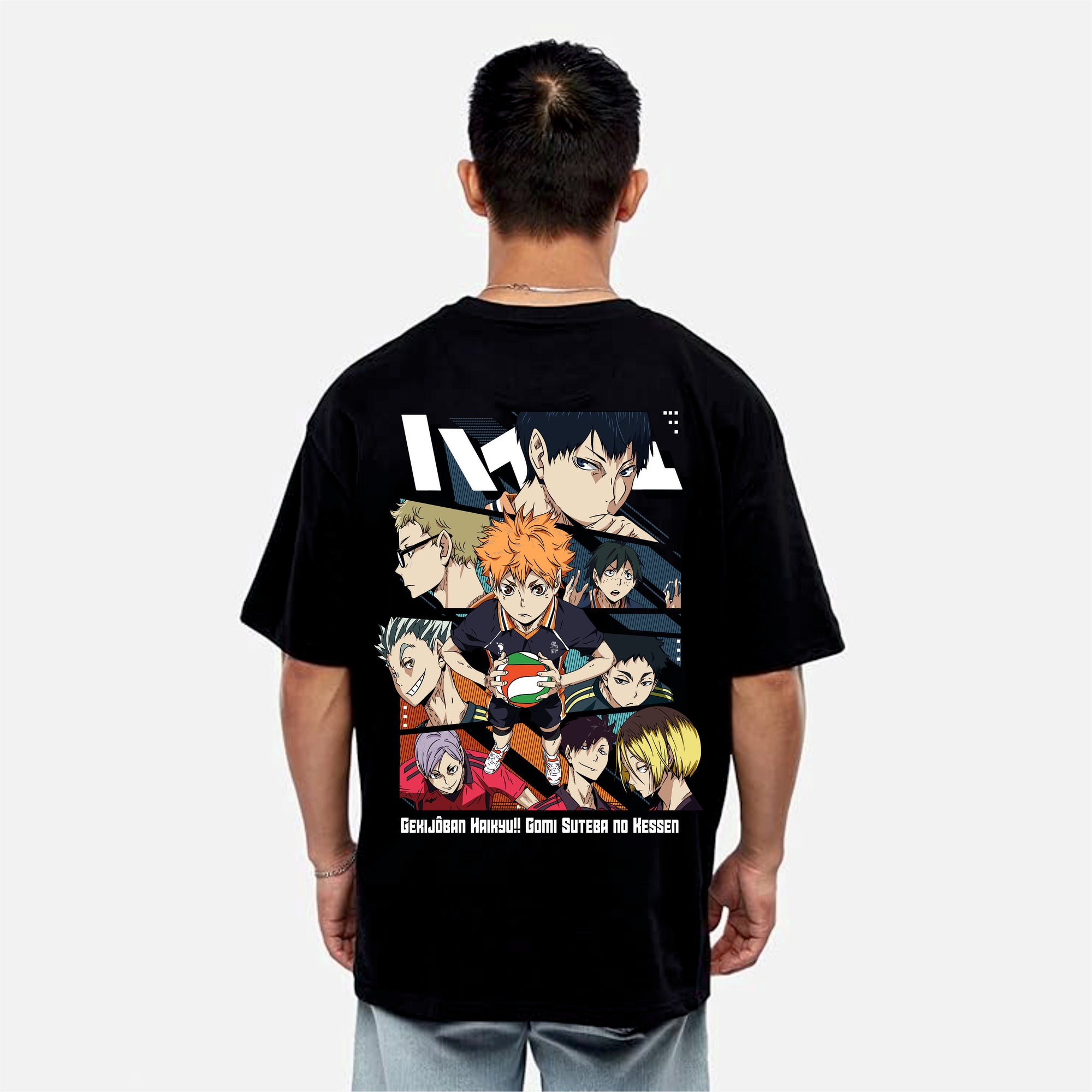 Person wearing a black t-shirt with anime character collage on the back