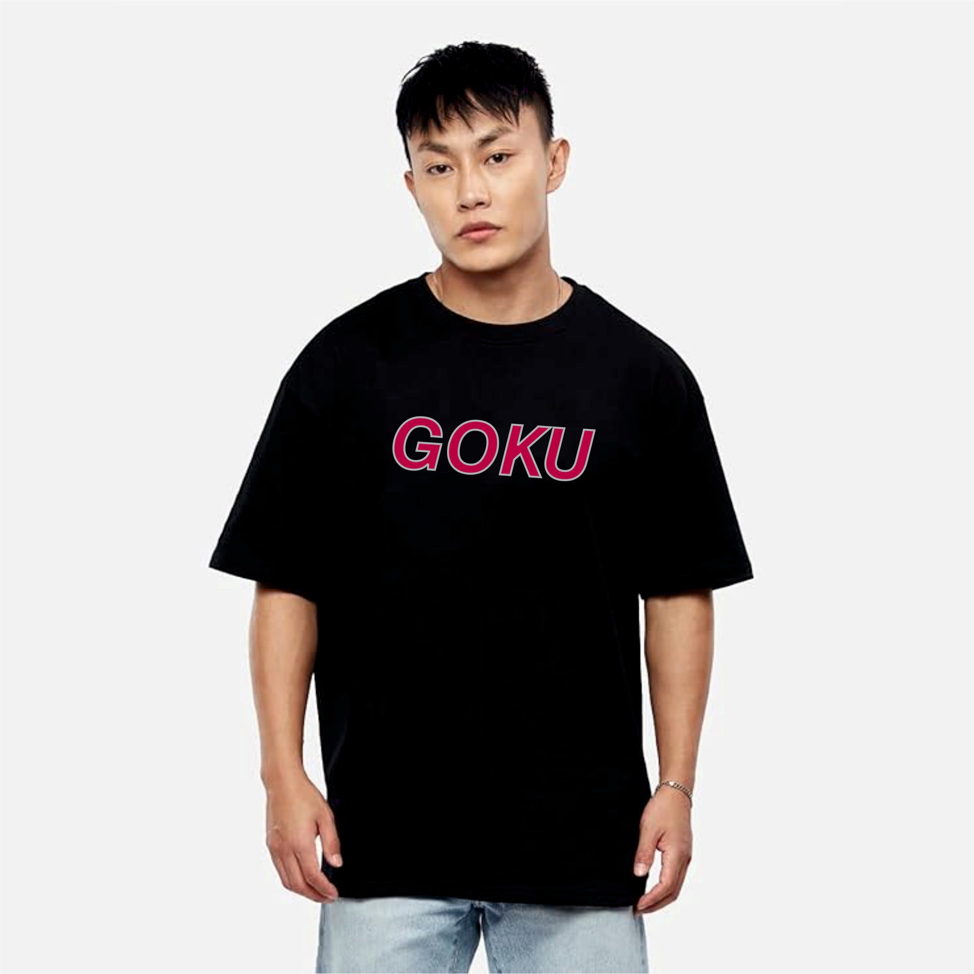 Person wearing a black t-shirt with 'GOKU' in pink on a white background
