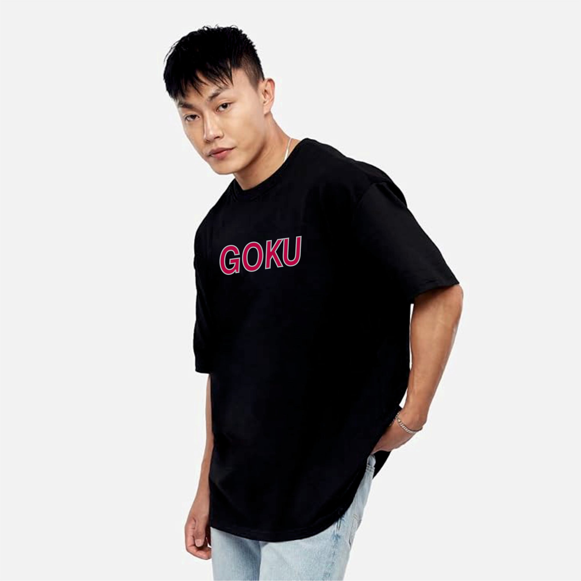 Person wearing a black t-shirt with 'GOKU' in pink on a light gray background