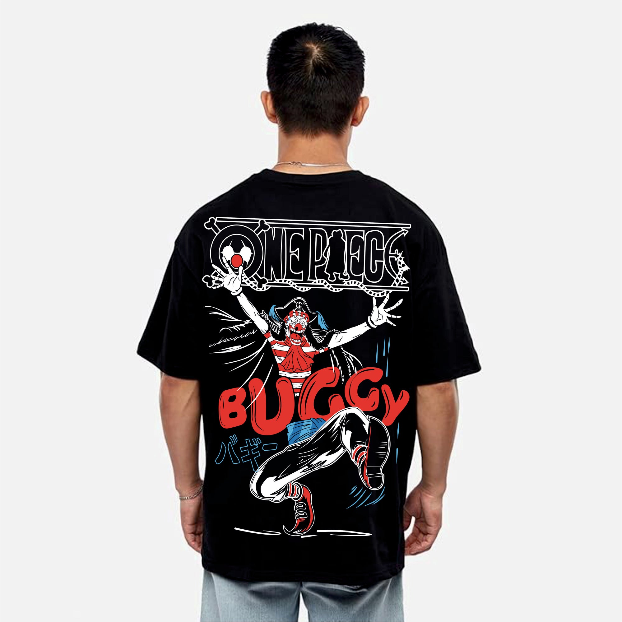 Person wearing a black t-shirt with a colorful design on the back, featuring a character and text.