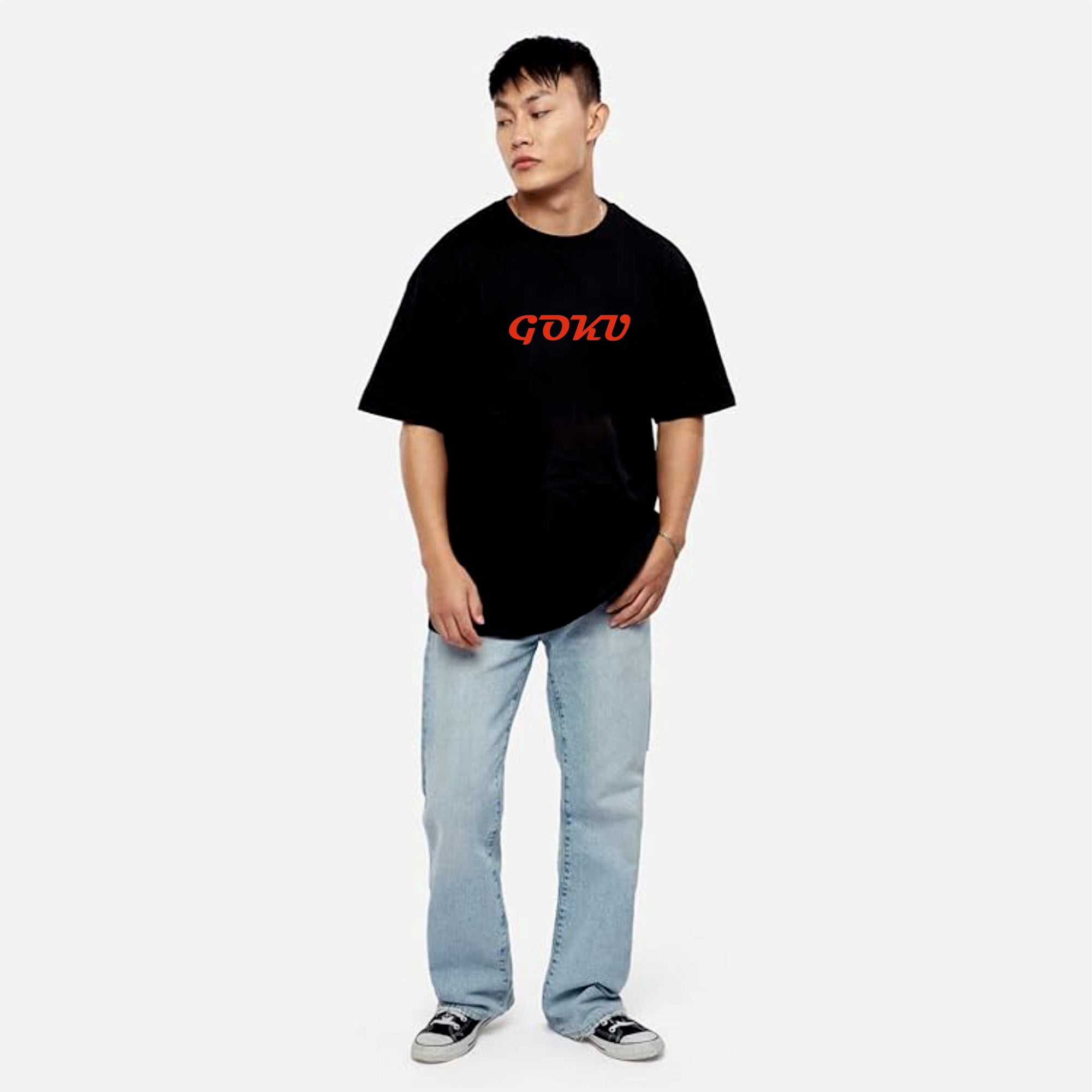 Person wearing a black t-shirt with red text