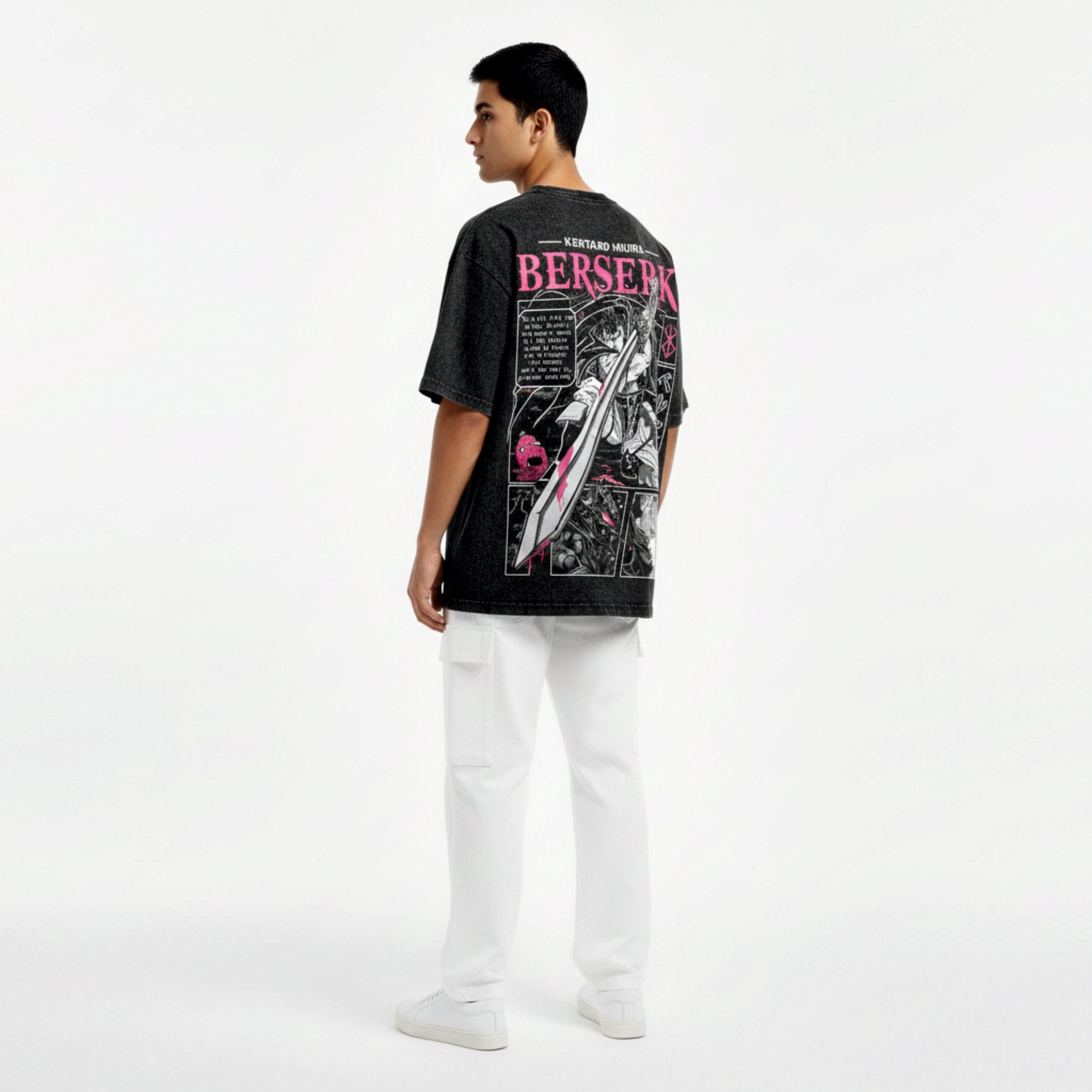 Person wearing a black t-shirt with graphic design and text on the back, standing against a white background