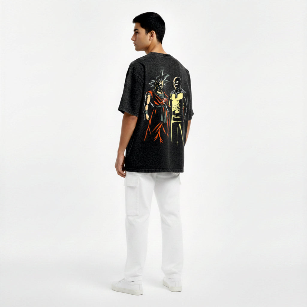 Person wearing a black t-shirt with graphic designs on a white background