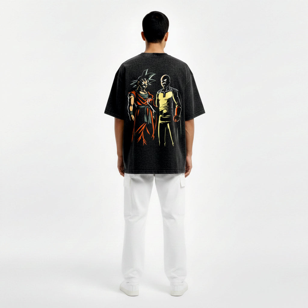 Person wearing a black t-shirt with colorful graphic design on the back, standing against a white background