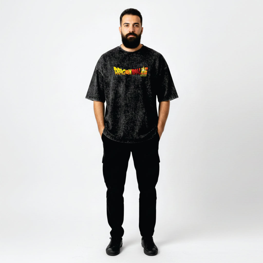 Man wearing a black t-shirt with a colorful graphic on a white background