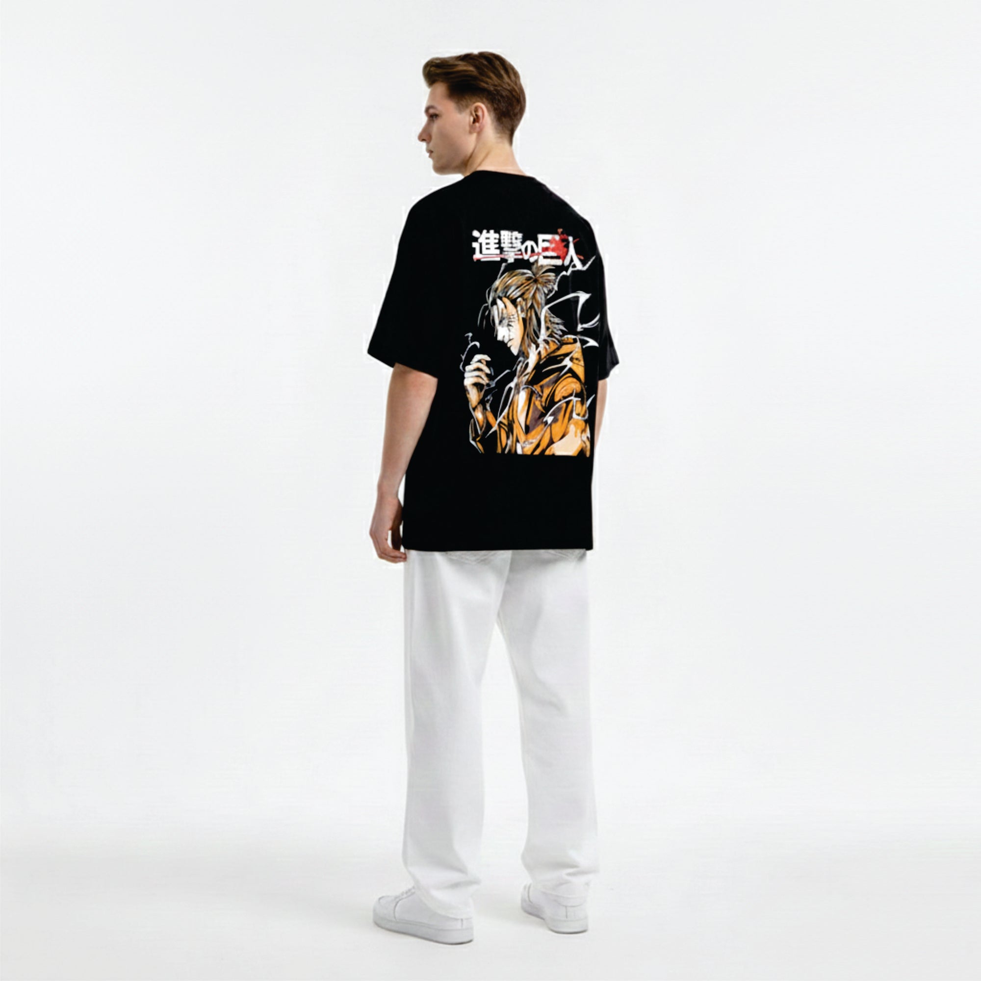 Person wearing a black t-shirt with anime design on a white background