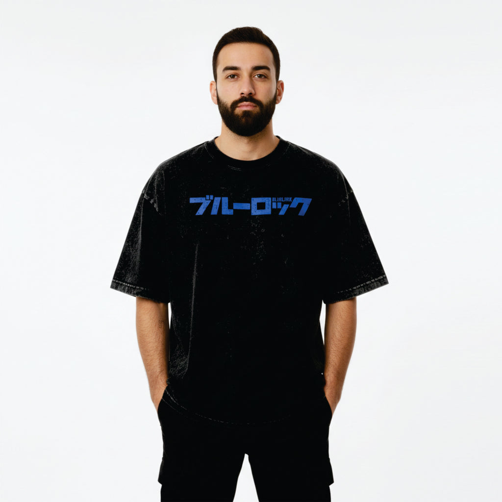 Man wearing a black t-shirt with blue text on a white background
