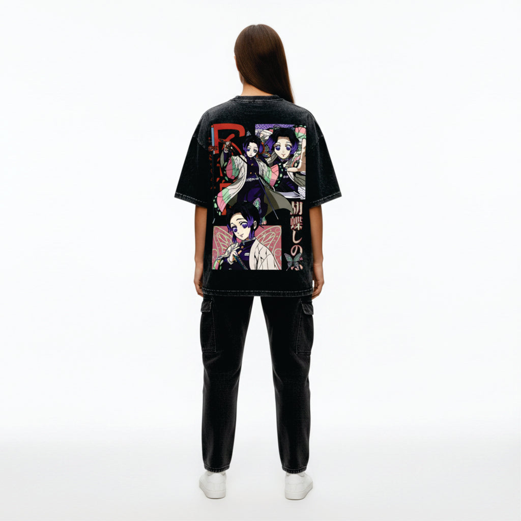 Person wearing a black t-shirt with colorful graphic design on the back, standing against a white background