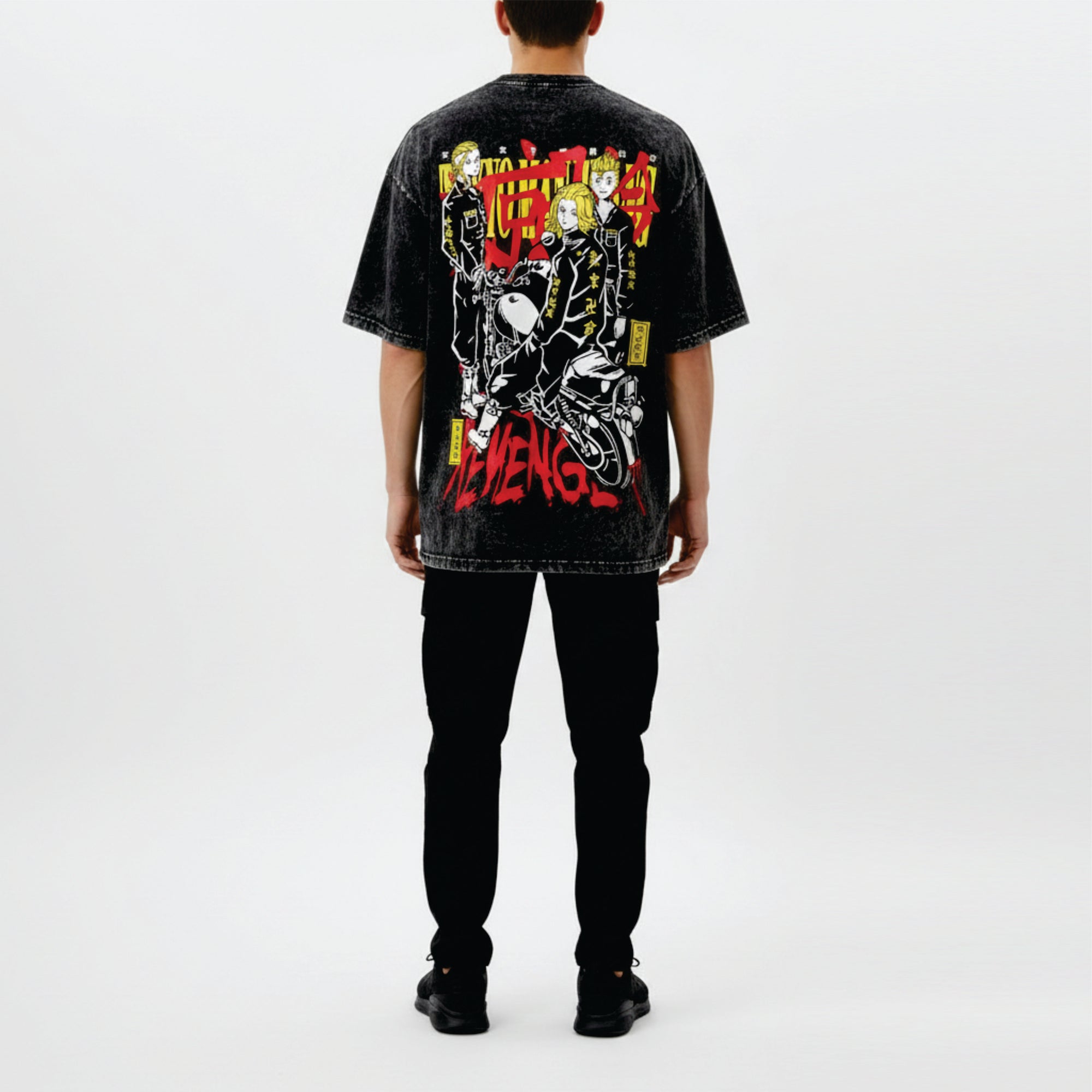 Person wearing a black t-shirt with colorful graphic design on the back, standing against a white background