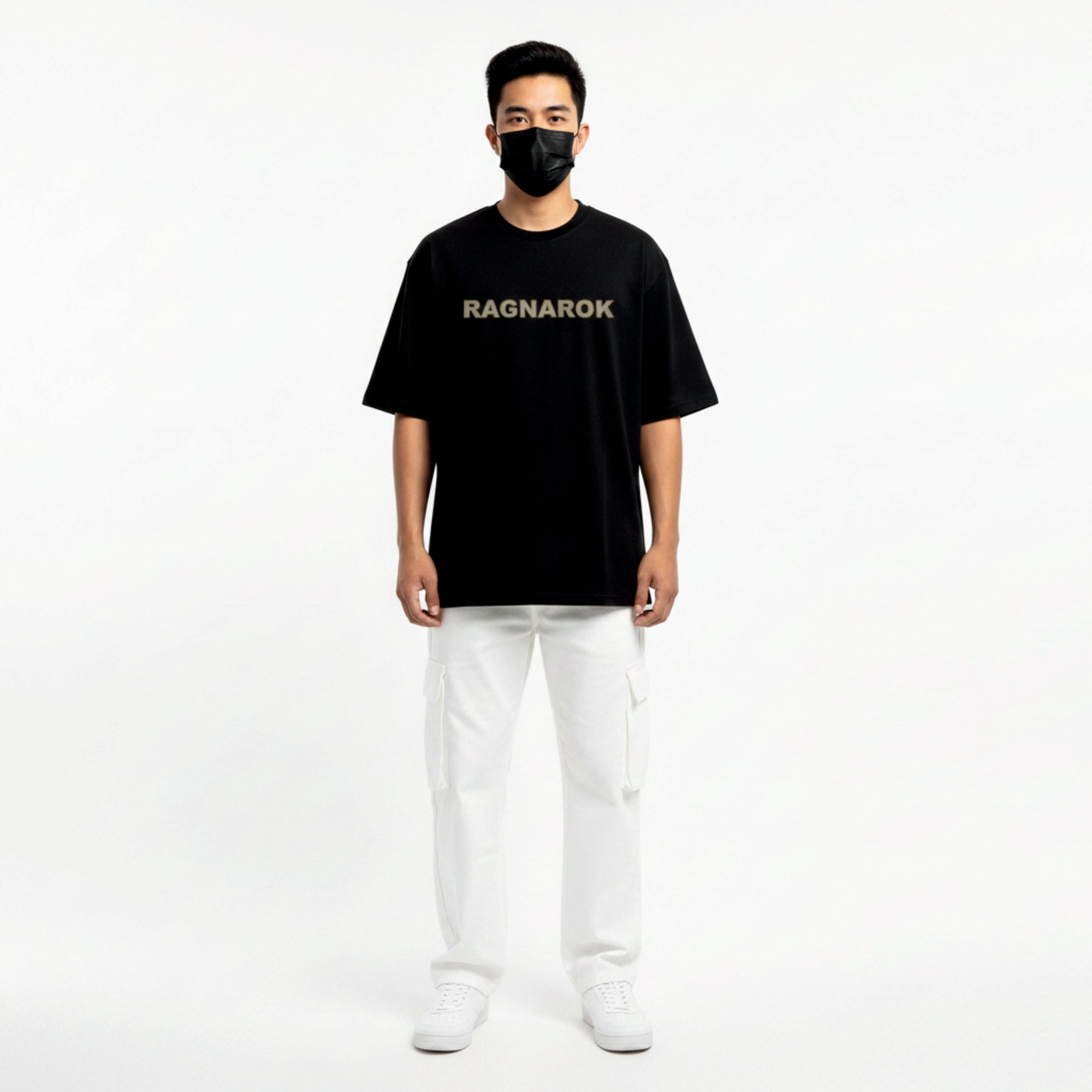 Person wearing a black 'RAGNAROK' t-shirt on a white background