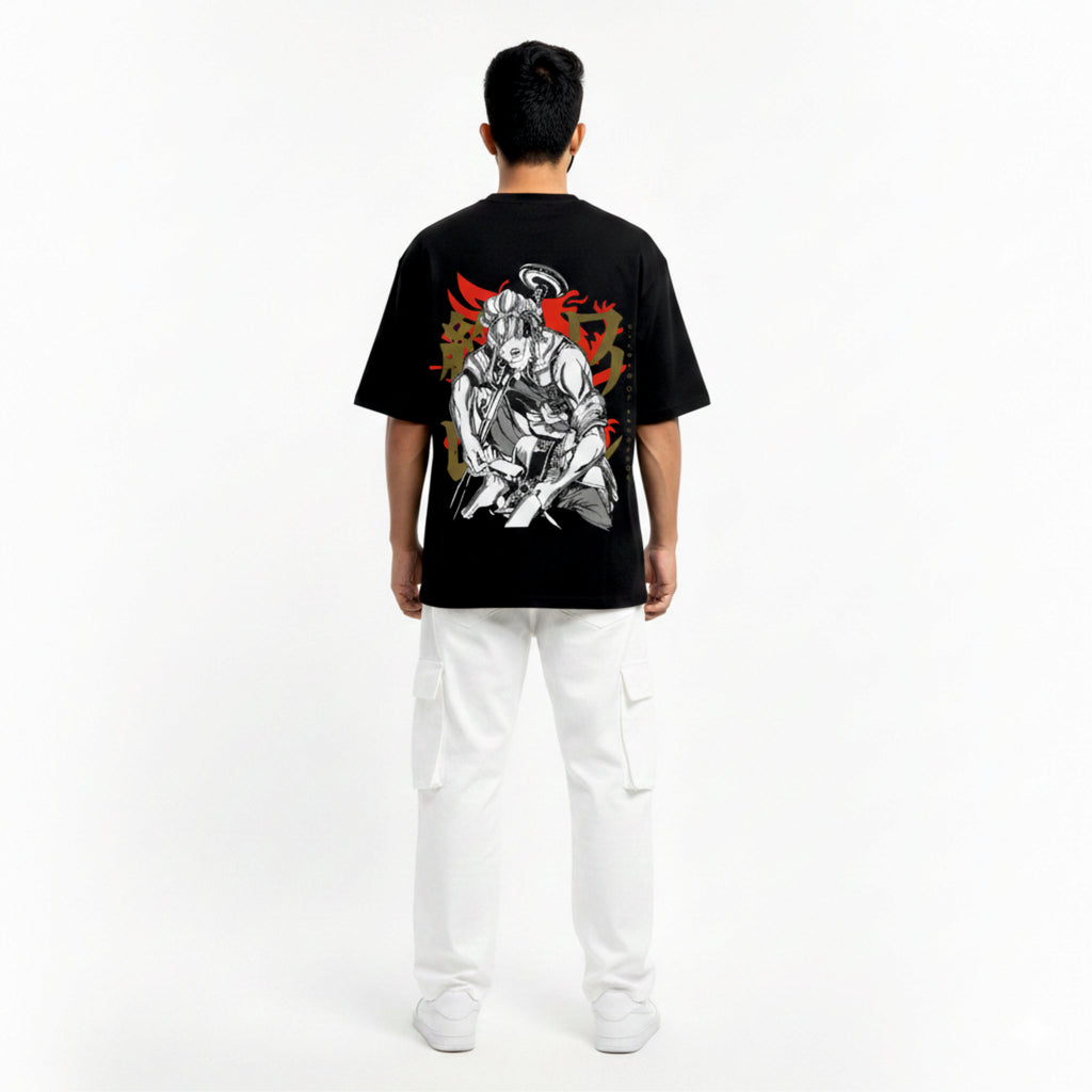 Person wearing a black t-shirt with a graphic design on the back, standing against a white background