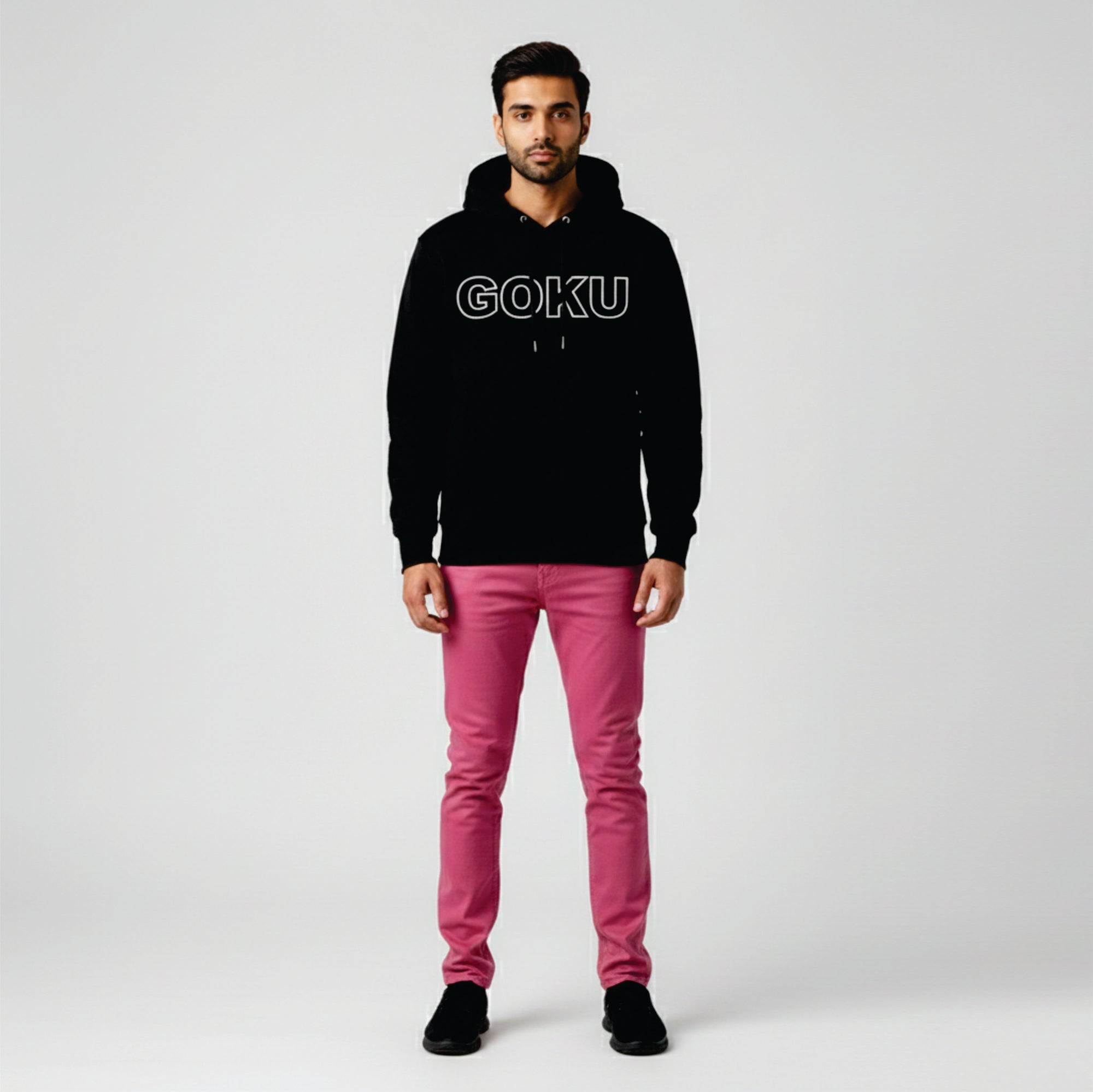 Person wearing a black hoodie with 'GOKU' text and pink pants on a white background
