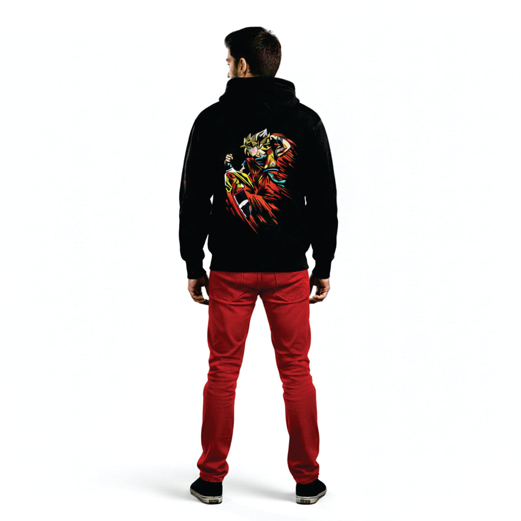 Person wearing a black hoodie with a colorful design on the back and red pants against a white background