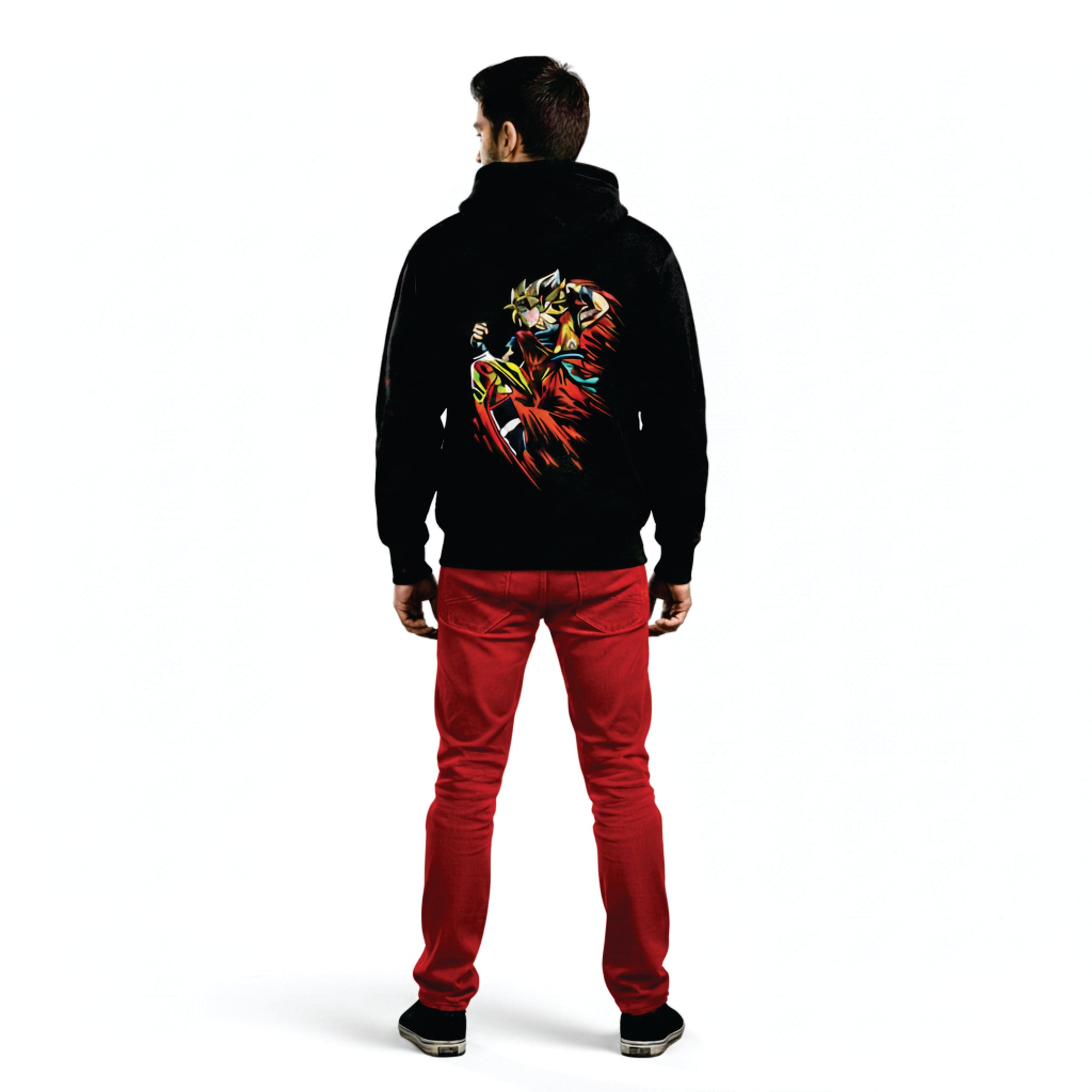 Person wearing a black hoodie with a colorful design on the back and red pants against a white background