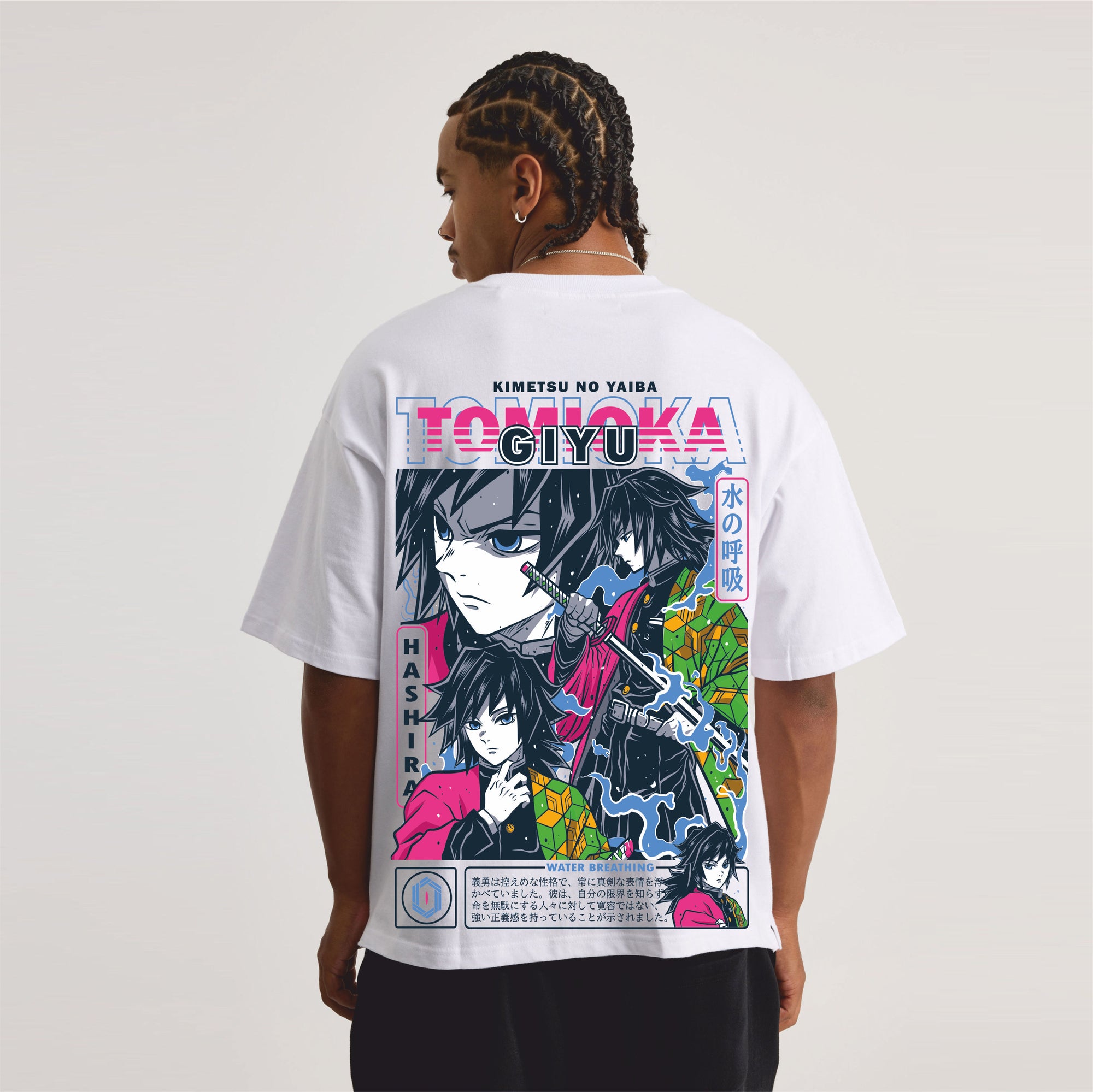 Person wearing a white t-shirt with colorful graphic design on the back