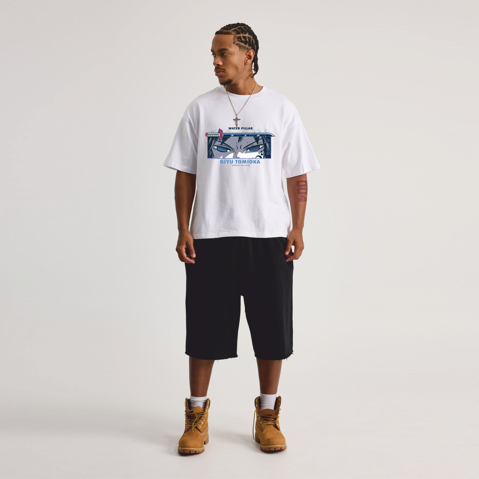 Person wearing a white t-shirt with graphic design