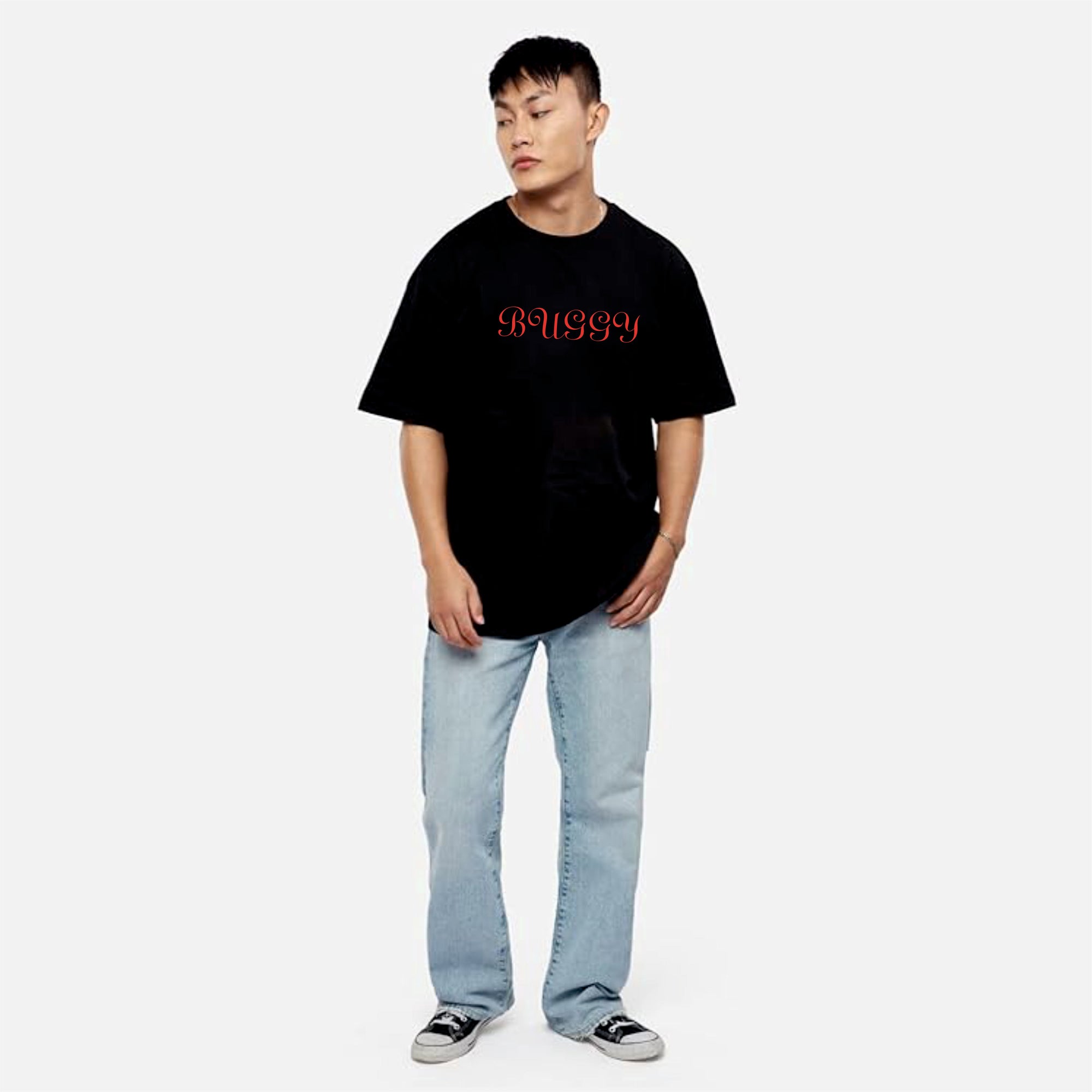 Person wearing a black t-shirt with red text