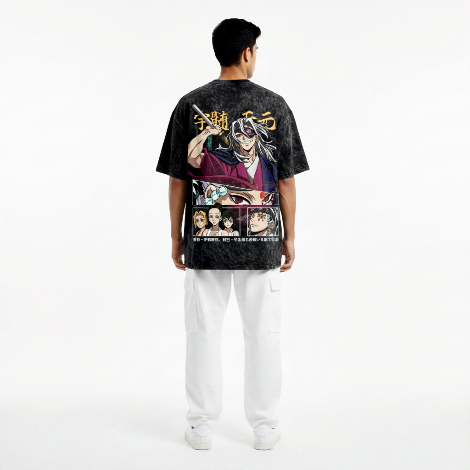 Person wearing a black t-shirt with colorful graphics and text on the back, standing against a white background.