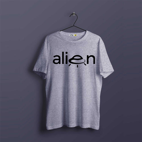 Gray t-shirt with 'alien' graphic on a hanger against a dark background