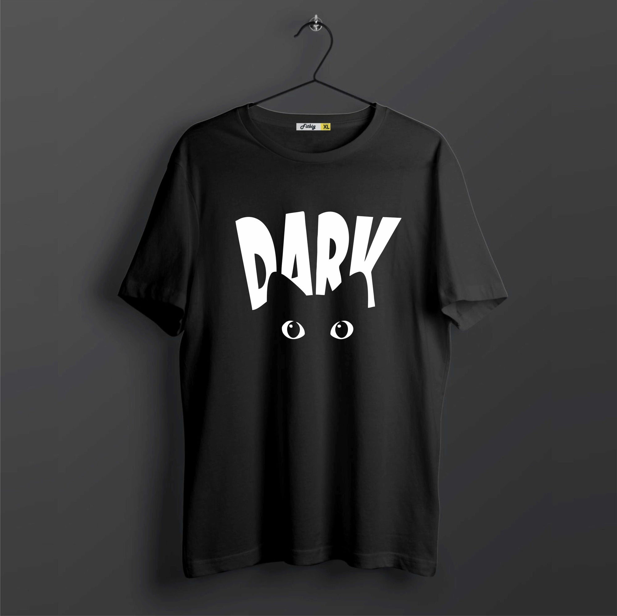 Black t-shirt with 'DARK' printed on it against a dark background