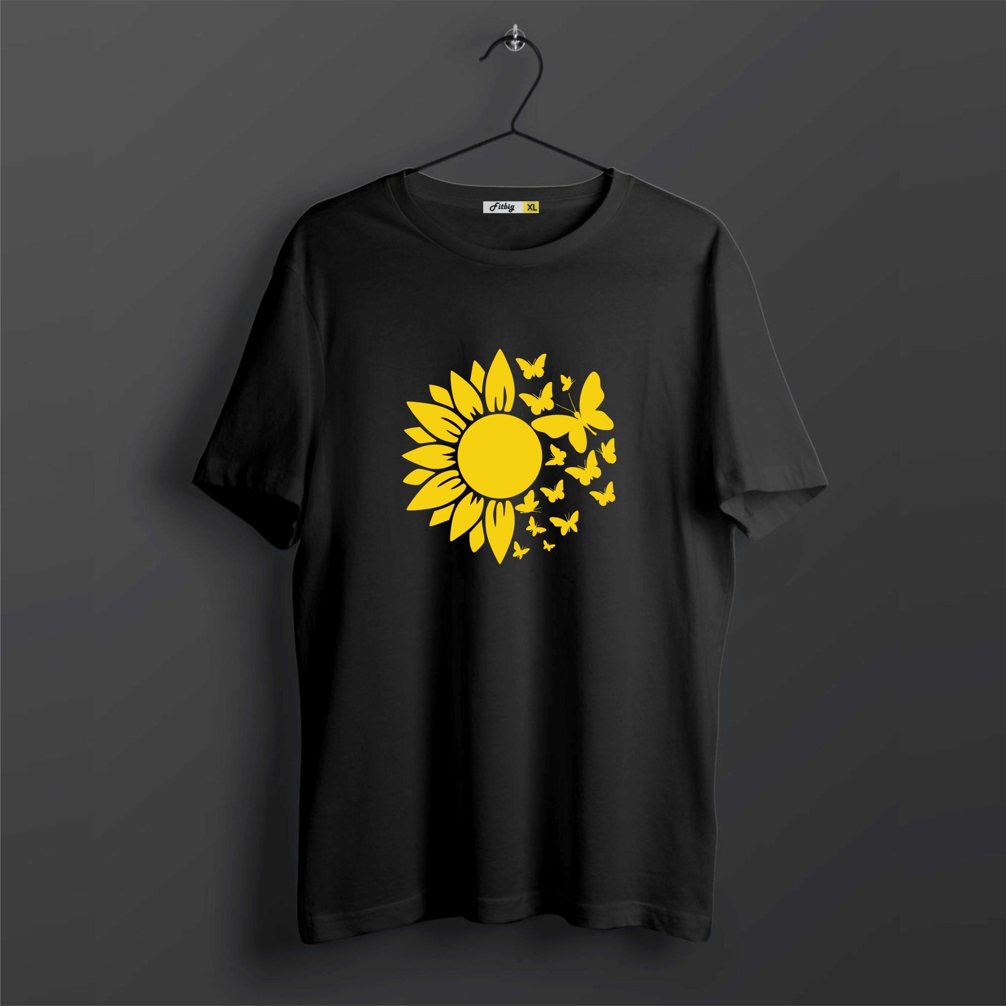 Black t-shirt with a yellow sunflower design on a dark background