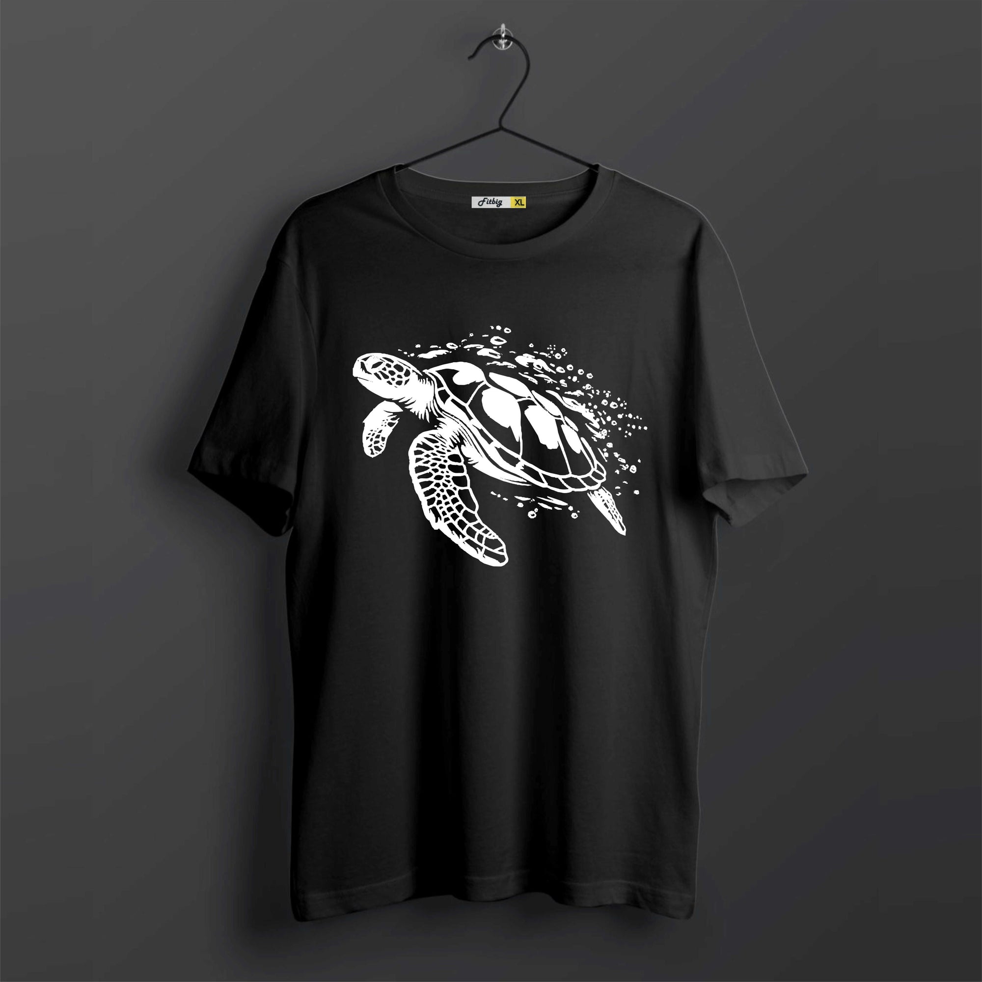 Black t-shirt with a white turtle design on a dark background