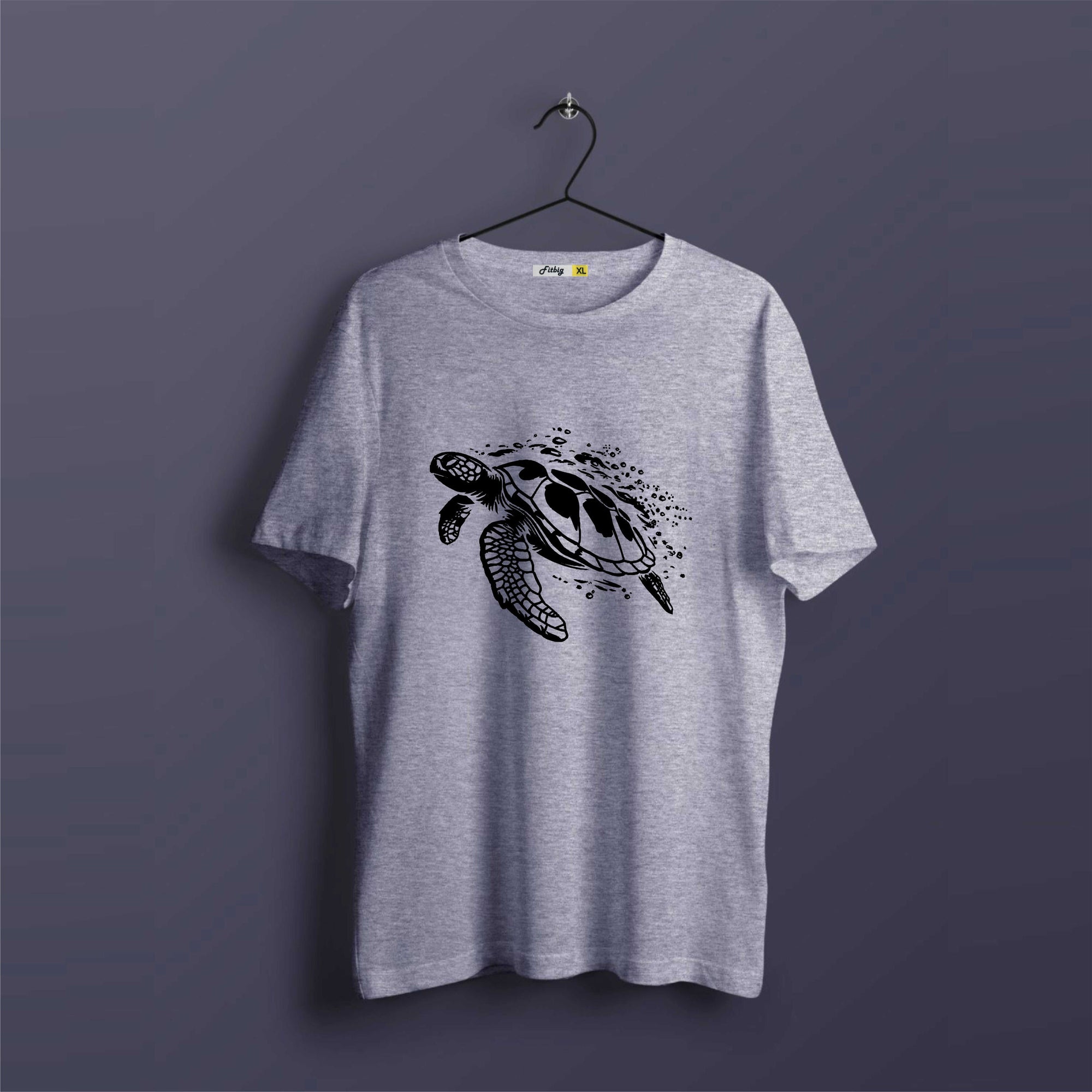 Gray t-shirt with a turtle design on a dark purple background