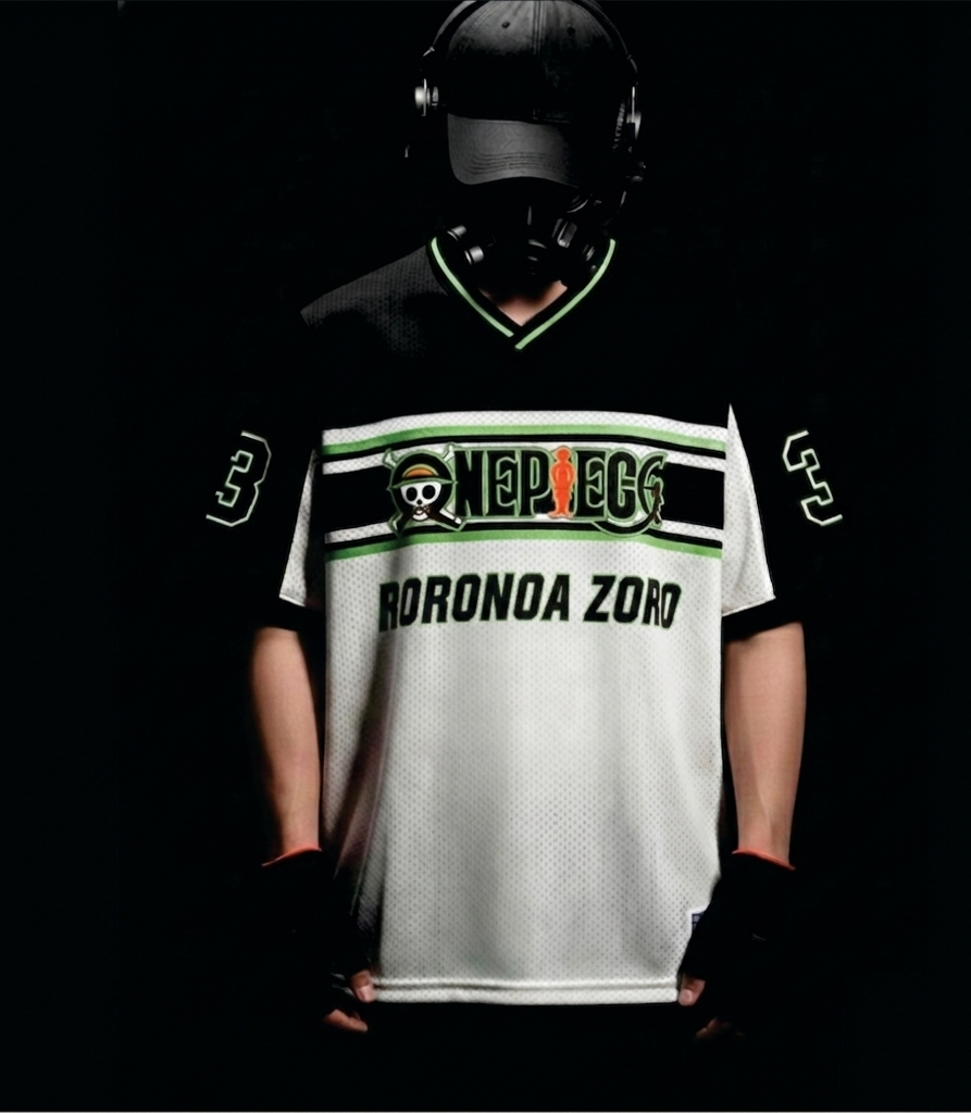 Person wearing a white sports jersey with black and green accents, featuring a character design on a dark background.