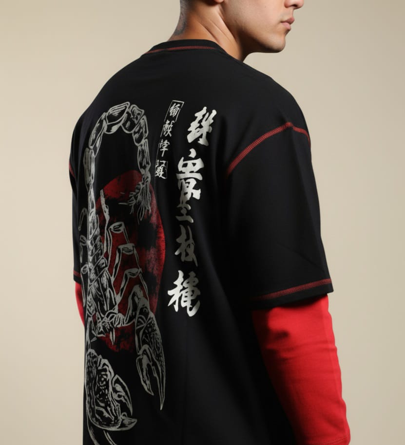 Person wearing a black jacket with red accents and white designs on the back, against a beige background.