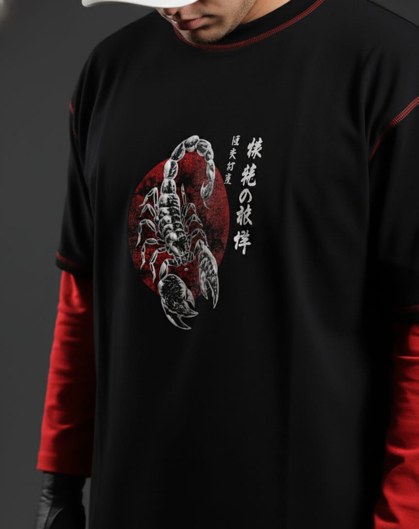 Person wearing a black and red long-sleeve shirt with a scorpion design and Japanese text.