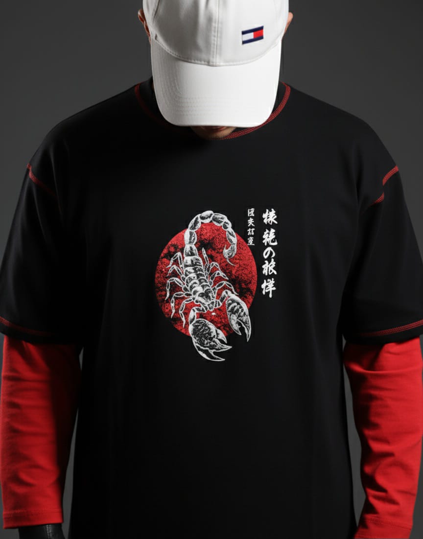 Person wearing a black and red long-sleeve shirt with a scorpion design and Japanese text.
